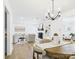 Bright, open living room with a cozy fireplace and seamless flow to the dining area, perfect for modern living at 4905 Chestnut Lake Dr, Charlotte, NC 28227