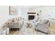 Bright living room features a cozy fireplace, stylish furnishings, and a neutral color palette with natural light at 4905 Chestnut Lake Dr, Charlotte, NC 28227