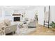 Charming living room with a brick fireplace, built-in shelving, and comfortable seating with warm natural light at 4905 Chestnut Lake Dr, Charlotte, NC 28227
