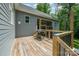 Wooden deck with wooden railings, black metal balusters, and a barbecue grill at 5215 Star Magnolia Ct, Clover, SC 29710