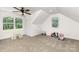 Bright bonus room with large windows, carpet, and a sloped ceiling, ideal for versatile use at 5215 Star Magnolia Ct, Clover, SC 29710