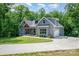 Charming exterior with gray siding, well-manicured lawn, and inviting front porch at 5215 Star Magnolia Ct, Clover, SC 29710