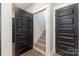 Hallway with several black doors leading to different rooms, offering a modern look at 5215 Star Magnolia Ct, Clover, SC 29710