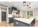 Stylish kitchen with white countertops, gray cabinets, modern appliances, and a large center island at 5215 Star Magnolia Ct, Clover, SC 29710