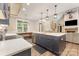 Stunning kitchen features a large island with a sink, modern lighting, and stainless steel appliances at 5215 Star Magnolia Ct, Clover, SC 29710
