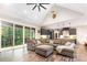 Open-concept living room and kitchen with hardwood floors, vaulted ceilings, and a large comfy couch at 5215 Star Magnolia Ct, Clover, SC 29710