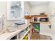 Convenient pantry area with shelves and countertop space for appliances and storage at 5215 Star Magnolia Ct, Clover, SC 29710