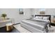 Bedroom featuring a neutral color palette, plush bedding, and stylish side tables at 5520 Chestnut Dr, Hickory, NC 28602
