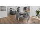 Modern dining area next to a chef's kitchen, featuring a stylish table set, and sliding doors to the backyard at 5520 Chestnut Dr, Hickory, NC 28602