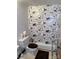 Unique bathroom with newspaper print wallpaper, standard toilet, and tile flooring at 5806 Whitingham Dr, Charlotte, NC 28215