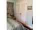 Cozy bedroom featuring a comfortable bed and a closet with louvered doors offering ample storage at 5806 Whitingham Dr, Charlotte, NC 28215