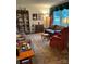 Cozy living room featuring comfortable sofas, a decorative cabinet, and large windows that illuminate the room at 5806 Whitingham Dr, Charlotte, NC 28215