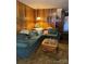 Inviting living room features comfortable seating, wood paneling, and a hanging lamp at 5806 Whitingham Dr, Charlotte, NC 28215