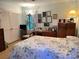 Serene bedroom featuring a decorative bedspread, ample closet space, and a cozy reading corner by the window at 5806 Whitingham Dr, Charlotte, NC 28215