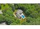 Aerial shot of a beautiful property with pool, surrounded by trees at 5812 Morgan Park Dr, Monroe, NC 28110