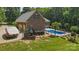 An aerial view of a house featuring a boat, pool, well-manicured lawn, and garage at 5812 Morgan Park Dr, Monroe, NC 28110