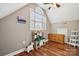 A cozy bedroom nook with an arched window, hardwood floors, and a toy kitchen at 5812 Morgan Park Dr, Monroe, NC 28110