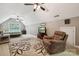 Bonus room with vaulted ceilings, ceiling fans, TV, and comfy recliner seating at 5812 Morgan Park Dr, Monroe, NC 28110