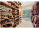 Walk-in closet with custom shelving, providing ample storage for clothes and shoes at 5812 Morgan Park Dr, Monroe, NC 28110