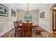 Spacious dining room featuring wood table, bench seating and decorative lighting at 5812 Morgan Park Dr, Monroe, NC 28110