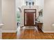Grand foyer boasts gleaming hardwood floors, soaring ceilings, and elegant details at 5812 Morgan Park Dr, Monroe, NC 28110