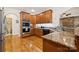 Kitchen area with granite countertops, stainless steel appliances, and wooden cabinetry at 5812 Morgan Park Dr, Monroe, NC 28110