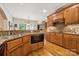 Spacious kitchen featuring granite countertops, wooden cabinetry, and breakfast area views at 5812 Morgan Park Dr, Monroe, NC 28110