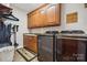 Laundry room with washer, dryer, sink, and storage cabinets at 5812 Morgan Park Dr, Monroe, NC 28110