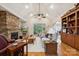 Inviting living room with stone fireplace, hardwood floors, and built-in shelving at 5812 Morgan Park Dr, Monroe, NC 28110