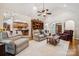 Open living area with hardwood floors, a fireplace and ample seating at 5812 Morgan Park Dr, Monroe, NC 28110