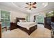 Spacious main bedroom with tray ceiling, large windows, and stylish furnishings at 5812 Morgan Park Dr, Monroe, NC 28110