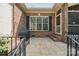 Brick patio with a grill, a step-down to the backyard and a view of the yard at 5812 Morgan Park Dr, Monroe, NC 28110