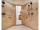 This is a dual-head tiled shower with adjacent bathroom vanity at 5812 Morgan Park Dr, Monroe, NC 28110