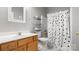 Bright bathroom featuring a wooden vanity, toilet, and shower at 6129 Caseys Side Way, Fort Mill, SC 29708