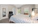 Serene bedroom featuring plush carpeting, a cozy bed, and a private balcony overlooking the backyard at 6129 Caseys Side Way, Fort Mill, SC 29708
