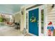 Welcoming front porch with a vibrant blue door adorned with a wreath, creating a charming entrance at 6129 Caseys Side Way, Fort Mill, SC 29708