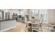Bright kitchen and dining area boasting stainless appliances, custom cabinets, and natural light at 6129 Caseys Side Way, Fort Mill, SC 29708
