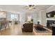 Open concept living space featuring wood floors, a fireplace, and a charming breakfast nook at 6129 Caseys Side Way, Fort Mill, SC 29708