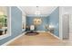 Bright home office with neutral walls, hardwood floors, and ample natural light at 6129 Caseys Side Way, Fort Mill, SC 29708