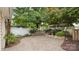 Beautiful outdoor patio with brick pavers, garden, and fountain at 6129 Caseys Side Way, Fort Mill, SC 29708