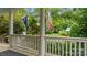 Inviting porch view featuring a manicured lawn and landscaping with an American flag at 6129 Caseys Side Way, Fort Mill, SC 29708