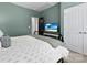 Calming bedroom with a wrought iron bed and soothing green walls at 6261 Six String Ct, Fort Mill, SC 29708