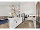 Modern kitchen featuring a large island, stainless steel appliances, and open to the living area at 6261 Six String Ct, Fort Mill, SC 29708