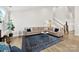 Bright living room with stylish furniture, hardwood floors, and a staircase at 6261 Six String Ct, Fort Mill, SC 29708