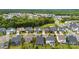 Aerial view showcasing a well-maintained neighborhood with lush greenery and manicured lawns at 6261 Six String Ct, Fort Mill, SC 29708