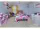 Charming bedroom with cheerful decor, a twin bed, whimsical accents, and playful organization at 6914 Evanton Loch Rd, Charlotte, NC 28278