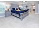 Bright main bedroom with a king-size bed, carpet flooring, and an ensuite bathroom for ultimate privacy at 6914 Evanton Loch Rd, Charlotte, NC 28278