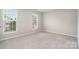 Cozy bedroom with carpet, natural light, and neutral walls at 6922 Cascade Dream Ct, Huntersville, NC 28078