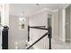An open stairway showcasing modern finishes and a decorative chandelier at 6922 Cascade Dream Ct, Huntersville, NC 28078