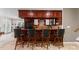 Wet bar with seating and cabinetry, perfect for entertaining guests at 7412 Sahalee Dr, Denver, NC 28037